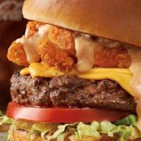 The Bloomin' Burger® · Topped with Bloomin’ Onion® petals, American cheese, lettuce, tomato, house-made pickles, on...