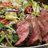 Steakhouse Salad · Seared center-cut sirloin, mixed greens, Aussie Crunch, tomatoes, red onions, green onions, ...