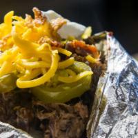 Bbq Baker · Huge baked potato stuffed topped with cheddar cheese, butter, bacon bits, and sour cream.
