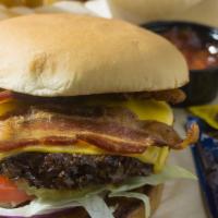 Smokehouse Burger · Half lb choice angus burger slow smoked and finished with a sweet and spicy glaze. Topped wi...