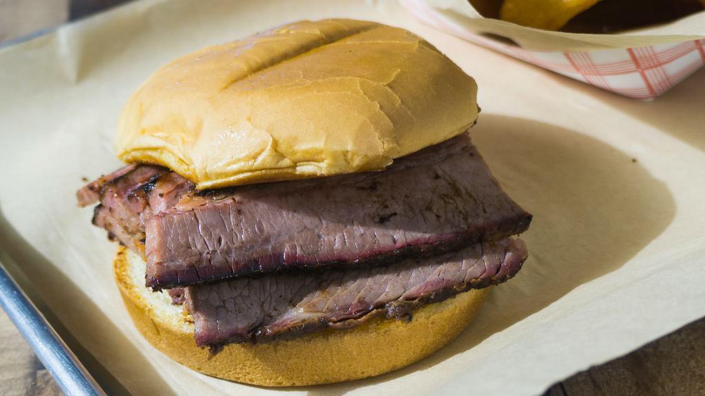 Brisket Sandwich · Slow smoked and brisket. Served with barbecue sauce on a toasted bun.