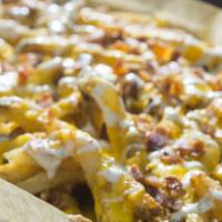 Cheese Fries · Hand-cut fries, covered with bacon, jalapeno ranch, and cheddar cheese.