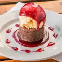 Mud Island Torte · Chocolate lava cake topped with vanilla ice cream and raspberry sauce.