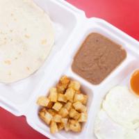 Ranchero Plate · Two eggs over easy with side of ranchero sauce.
