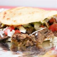 Gordita · One handmade thick corn tortilla fried and stuffed with your choice of meat, lettuce, tomato...