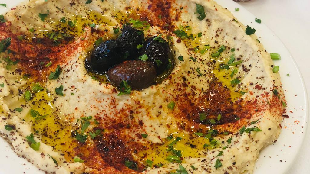 Hummus & Pita · Pureed garbanzo beans and tahini with spices and oil