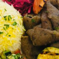 Gyro Plate · Seasoned lamb & beef marinated & cooked an a vertical grill, Served with rice grilled vegeta...