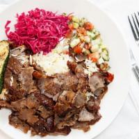 Doner Kebap Plate · Seasoned lamb and beef marinated overnight & cooked on a vertical grill. Centuries old tradi...