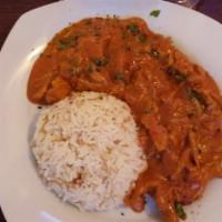 Butter Chicken · Chicken sauteed with pepper, onions, tikka, curry in a creamy butter tomato sauce.