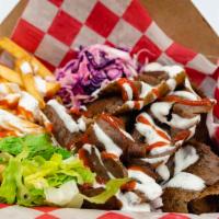 Euro Box · Choice of meat or falafel on a bed of seasoned fries alongside of marinated cabbage and lett...