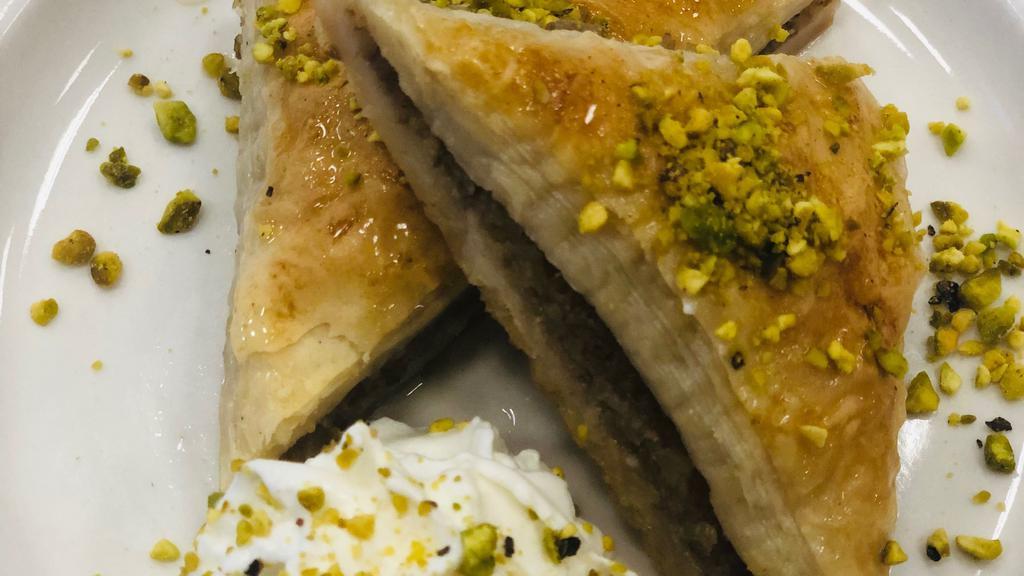 Baklava · Buttery pastry filled with walnuts & smothered with syrup.