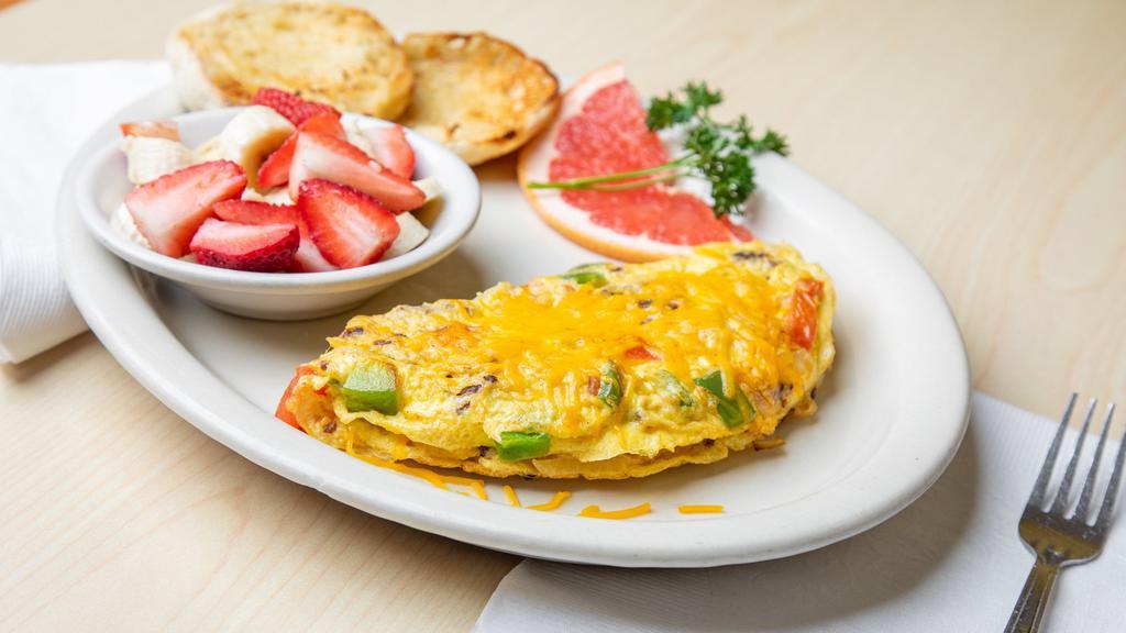 Tex-Mex Omelette · Made with ground beef, onion, bell pepper, tomato and cheddar cheese.
