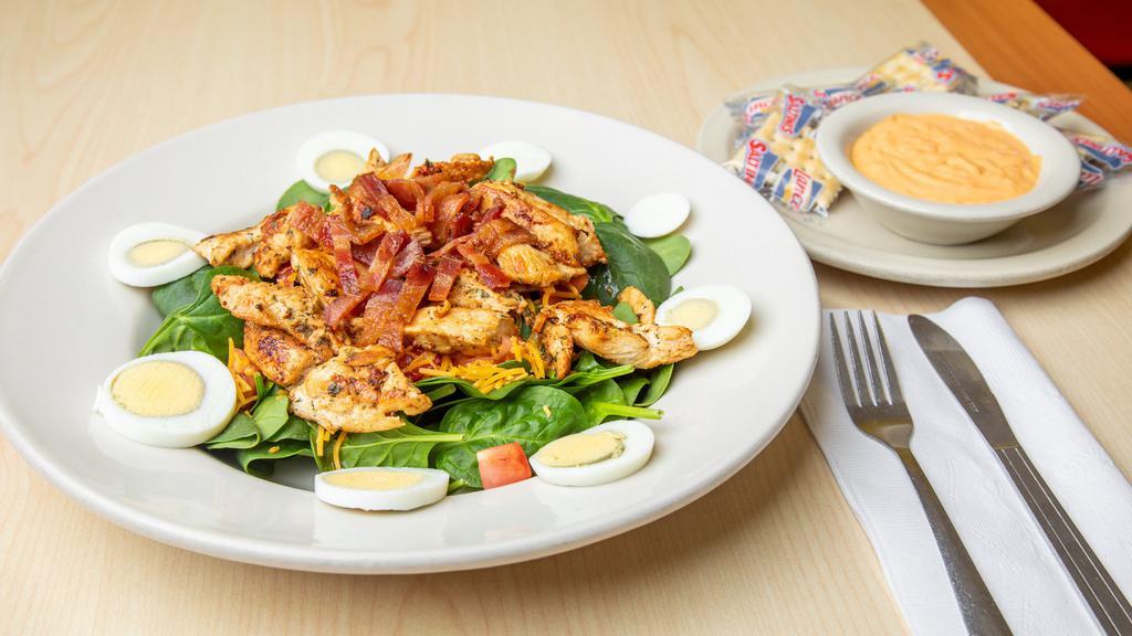 Nena'S Salad · Grilled chicken breast, fresh spinach, bacon bits, cheddar cheese, tomato & hard boiled egg.