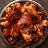 Bbq Chicken Wings · Mouthwatering Chicken wings, tossed in a BBQ sauce and fried to perfection. Served in Custom...