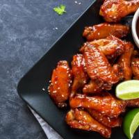 20 Chicken Wings, 2 Sides, & 2 Drinks · 20 Pieces of Mouthwatering Chicken Wings, fried to perfection. Served with customer's choice...