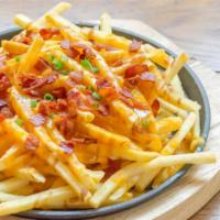 Bacon Cheese Fries · Delicious French fries deep fried 'till golden brown, and topped with crispy bacon and melte...