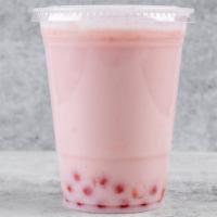 Strawberry Boba Tea · Boba Tea made with Green tea and topped with Strawberry Popping Pearls.