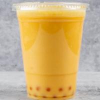 Passion Fruit Boba Tea · Boba Tea blended from Green Tea and topped with Passion Fruit popping pearls.