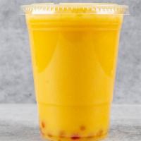 Mango Boba Tea · Boba tea blended with Green tea and topped with Mango popping pearls.