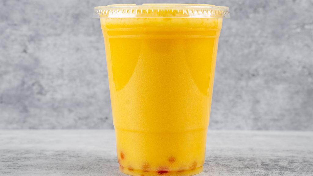 Mango Boba Tea · Boba tea blended with Green tea and topped with Mango popping pearls.
