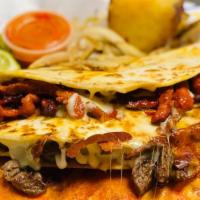 Quesadillas Plate · Two quesadillas (one meat option), rice and beans.