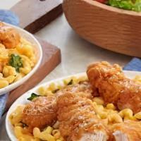 Mac And Cheese Tenders · Three crispy fried chicken tenders topped with gooey mac and cheese and bacon bits with your...