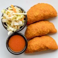 Pasteles · Fried meat pies. Three pieces.
