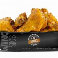 10Pc Traditional · Fresh, never frozen, deep fried bone-in wings. Includes a mix of flats and drums tossed in y...