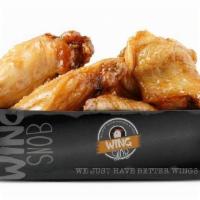 50Pc Traditional · Fresh, never frozen, deep fried bone-in wings. Includes a mix of flats and drums tossed in y...