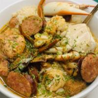 Seafood Gumbo · Blue Crab, Shrimp, Chicken & Andouille Sausage in a Rich Gumbo Roux over White Rice.