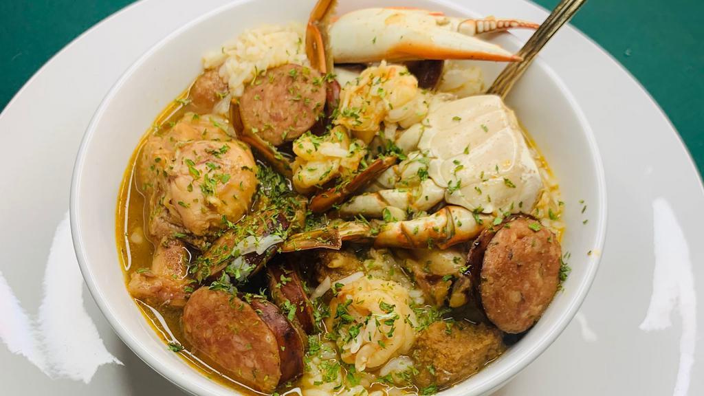 Seafood Gumbo · Blue Crab, Shrimp, Chicken & Andouille Sausage in a Rich Gumbo Roux over White Rice.