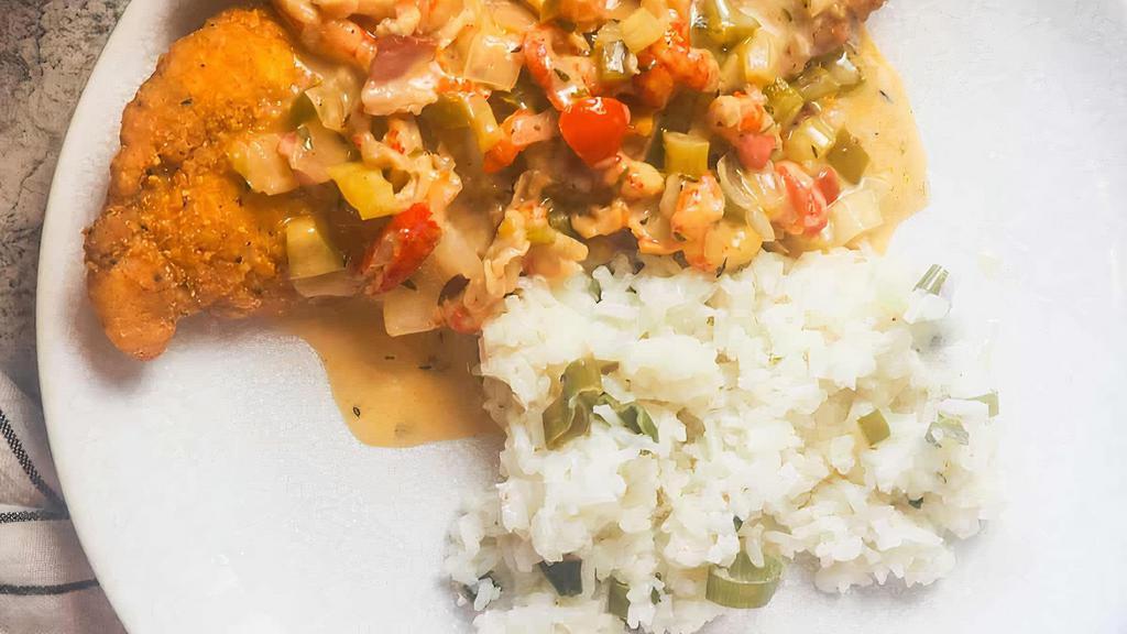 Smothered Fried Catfish  · Fried Catfish Smothered in Crawfish Etouffée Over White Rice + Side of Choice