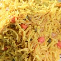 Biryani Rice · Iraqi-style vegetarian rice made from basmati
rice, mixed vegetables, and aromatic spices