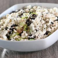 Greek Salad · Lettuce, cucumbers, tomatoes, fresh mint, feta cheese, and black olives tossed with a Greek-...