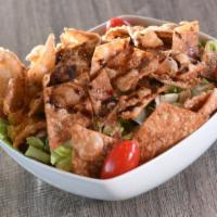 Fattoush · Lebanese salad with lettuce, tomatoes, cucumbers, bell peppers, onions and toasted pita chip...