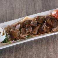 Gyro Sandwich · Beef and lamb mixture, wrapped in pita bread, and filled with tomatoes, red onions, and tzat...