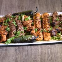 Family Kabob Plate · *8 Skewers:
Two skewers of beef kabab (kofta), 
chicken kabab (kofta), 
chicken tikka, 
and ...