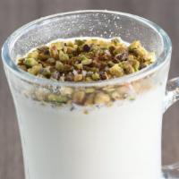 Sahlab · A hot drinkable dessert made from milk, sugar, rose water, starch, and topped with pistachio...