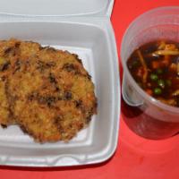 Egg Foo Young Shrimp · Peas, carrot, cabbage, water chestnut, and bamboo shoots mixed in a dark gravy poured on top...
