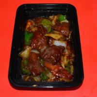 Shaking Beef · Diced chunk of beef, tomato, white onion and green pepper sauteed in our special dark sauce.