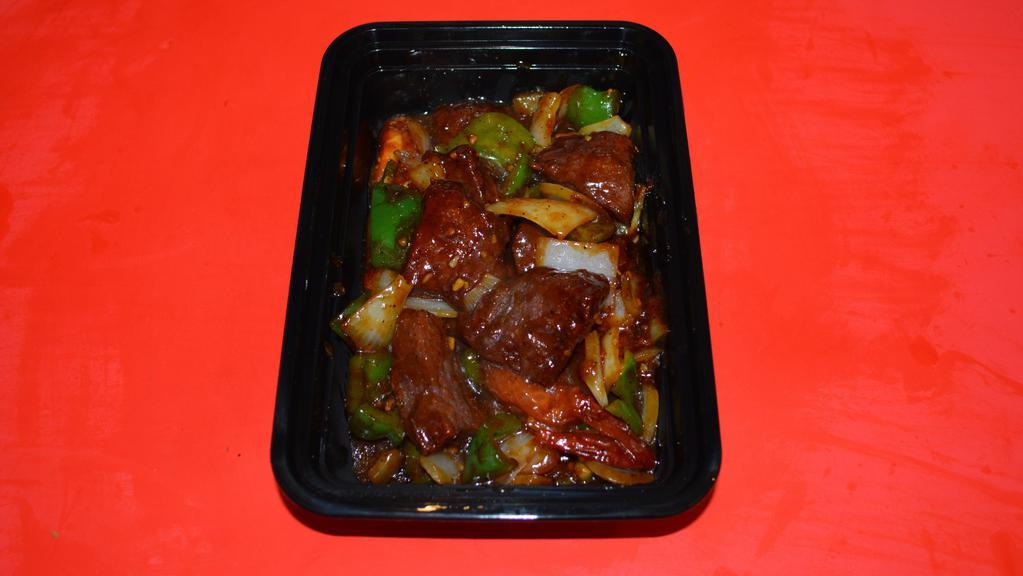 Shaking Beef · Diced chunk of beef, tomato, white onion and green pepper sauteed in our special dark sauce.