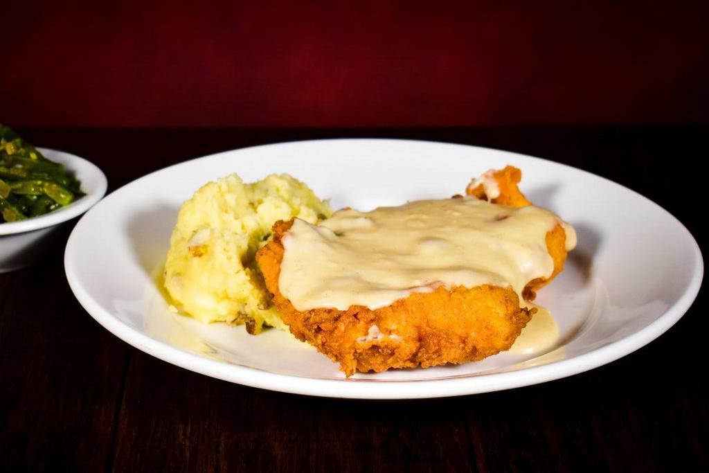 Country Fried Chicken · Tender chicken thighs hand-breaded, golden fried and topped with our lodge inspired scratch made cream gravy. Served with mashed potatoes & your choice of one scratch made side.