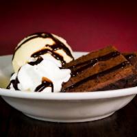 Chocolate Fudge Brownie · Warm fudge brownie topped with vanilla ice cream, chocolate sauce & whipped cream.