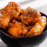 Signature Wings · Double-fried & perfeclty crispy on the outside, irrestistibly tender on the inside.