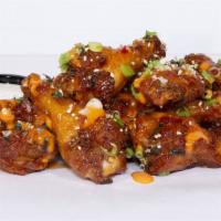 Kpop Wings · Sweet chili glaze, spicy mayo, wasabi furikake, scallions; served with miso ranch