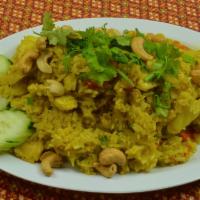 Curry Fried Rice · Curry powder, fresh ginger, onion, eggs and cucumber salad