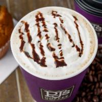 Mocha Cappuccino · Espresso and frothy steamed milk with a generous helping of Ghirardelli® cocoa and a swirl o...