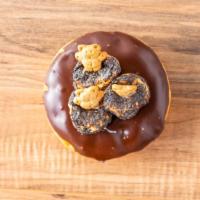 I Want S'More · Yeast ring dipped in chocolate icing, topped with toasted marshmallows and teddy grahams.