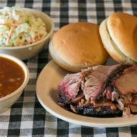 Family Pack · Feeds 3-4. Includes 1 lb of meat, BBQ sauce, 2 pints of sides & 4 buns or Texas toast.