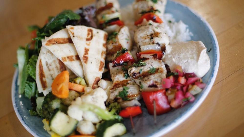 Kabob · Two skewered grilled chicken breast marinated in lemon juice and herbs, hummus & pita, pickle. Served with choice of rice or quinoa, and seasonal veggies.